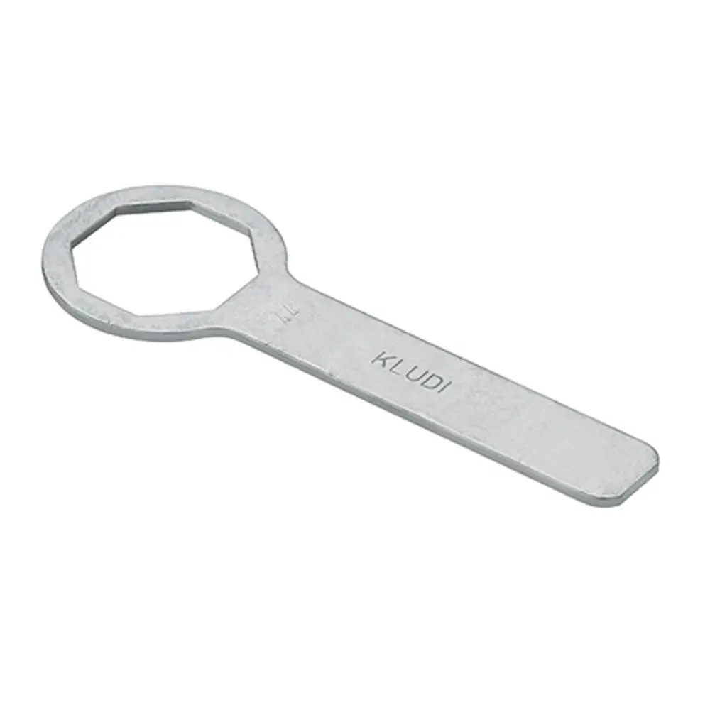 Spannschraubenschlüssel aus Metall mit einem flachen Griff und einem sechseckigen Kopf. Produkt von Kludi zur Anwendung bei bestimmten KLUDI-Geräten.